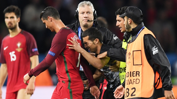 UEFA were not impressed that this fan got so close to Cristiano Ronaldo