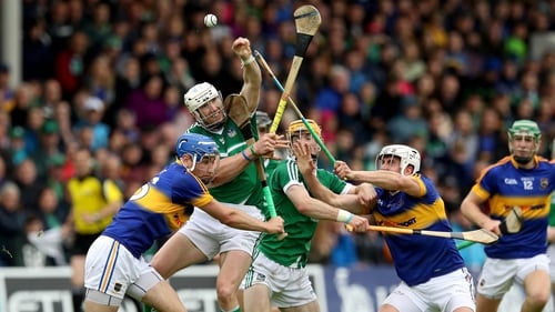 Tipperary's Patrick Maher and John McGrath battle with Seamus Hickey of Limerick