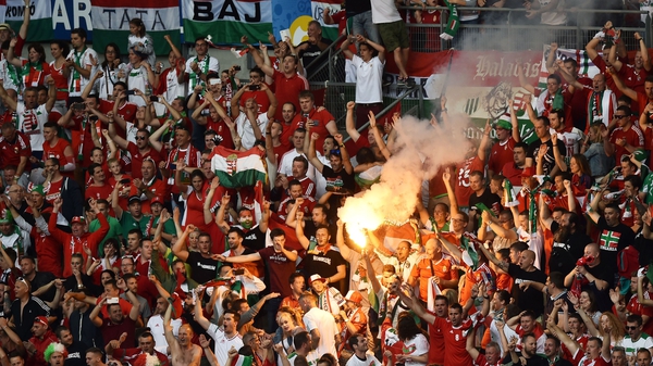 Hungary supporters threw flares onto the pitch at the end of their game against Iceland