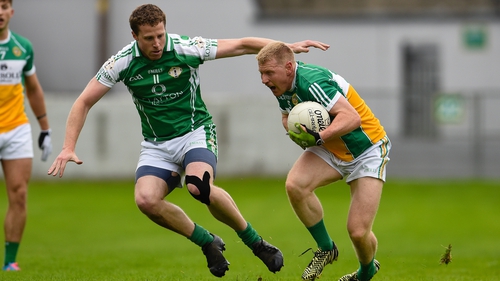 London's Mark Gottsche and Niall Darby of Offaly in action in Tullamore