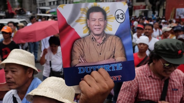 Activists march in Manila to show support for Rodrigo Duterte
