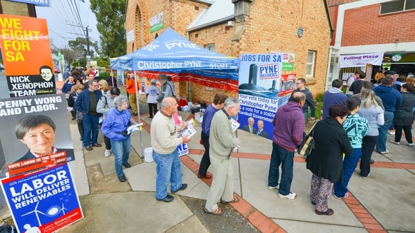 Voters queue outside a polling booth in Adelaide's suburb of Glynde, South Australia