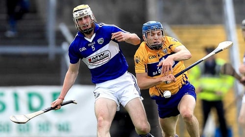 Leigh Bergin of Laois with Shane O'Donnell of Clare in action during their sides clash in Ennis