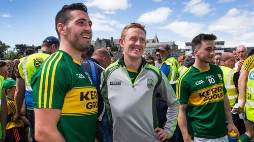 Kerry captain Bryan Sheehan with an injured Colm Cooper (C) after the game
