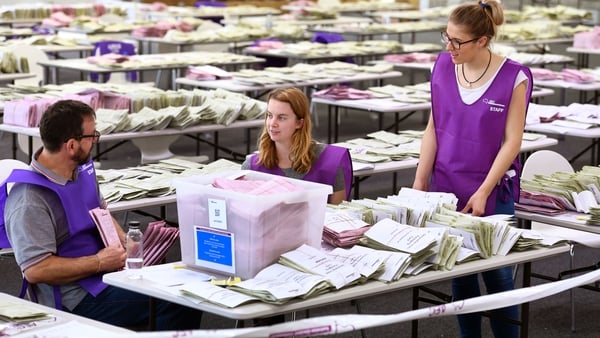 Australian Electoral Commission workers sort through absentee ballot papers in Sydney in 2016. Photo: Getty Images