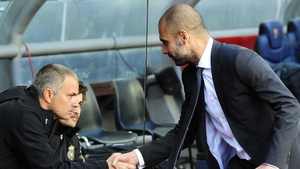 Mourinho and Guardiola exchange a frosty handshake during their time in Spain