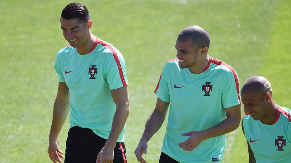 Pepe, centre, shares a joke with Cristiano Ronaldo during Portugal training on Saturday
