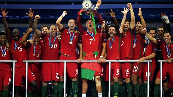 Cristiano Ronaldo hoists the trophy to spark wild Portugal celebrations