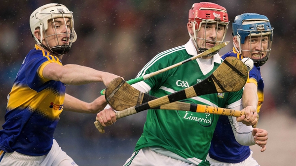 Tipperary's Ronan Maher and Paul Maher battle with Barry Nash of Limerick in Thurles