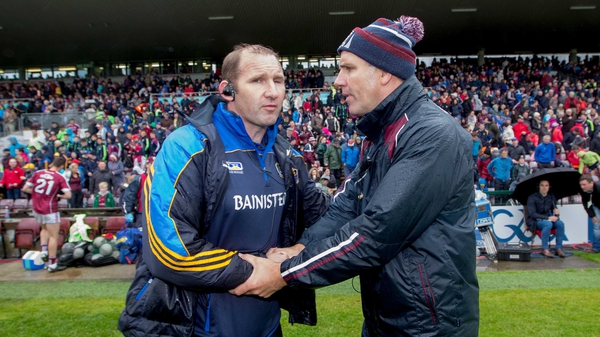 Roscommon joint-manager Fergal O'Donnel and Galway boss Kevin Walsh after last weekend's damp draw