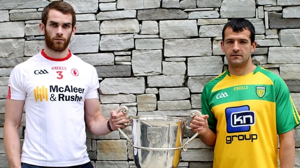 Tyrone's Ronan McNamee and Frank McGlynn of Donegal with the Anglo Celt Cup
