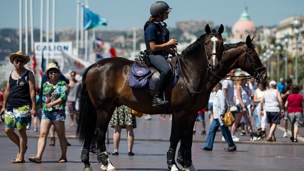 Mounted police patrol the Promenade des Anglais where the truck crashed into the crowd Thursday
