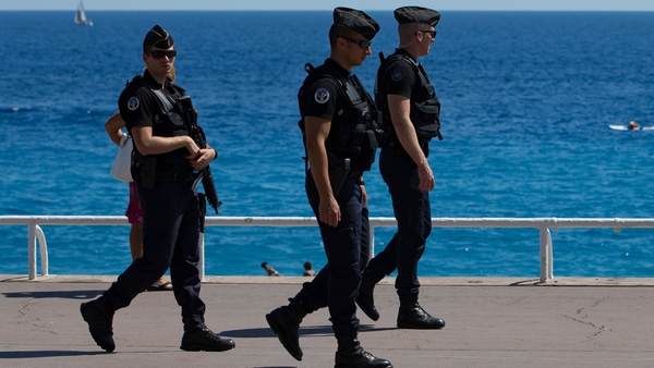 Gendarmes patrol on the Promenade des Anglais in Nice