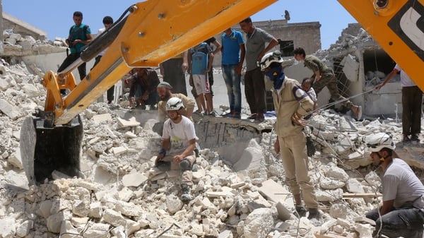 A search for survivors under the rubble of a collapsed building in Aleppo following reported air strikes earlier this week