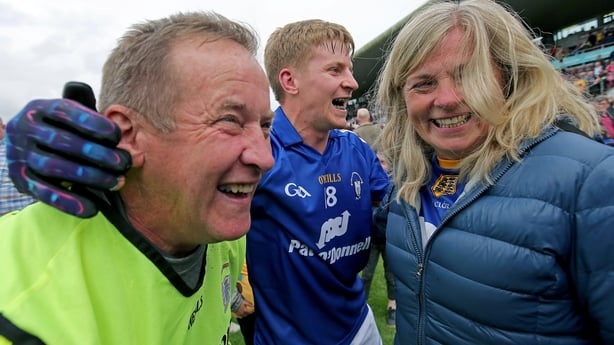 Colm Collins celebrates with his wife and Podge at full-time
