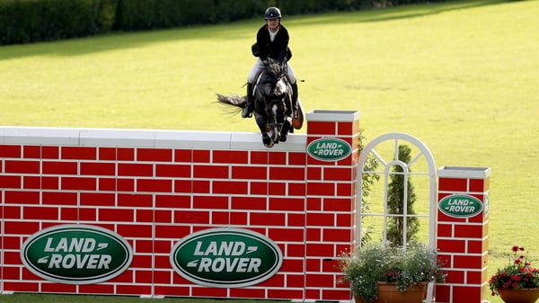 Jack O'Donohue and Acorad 3 soar over the puissance wall at the RDS