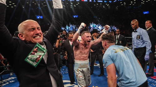 Carl Frampton (C) has won the belt that manager Barry McGuigan won back in 1985