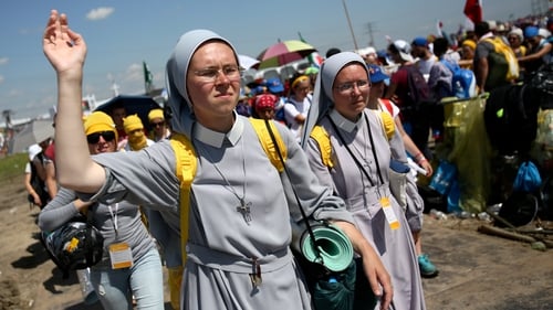 Pilgrims make their way home after the outdoor Mass