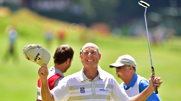 Jim Furyk celebrates after shooting a record setting 58 during the final round of the Travelers Championship