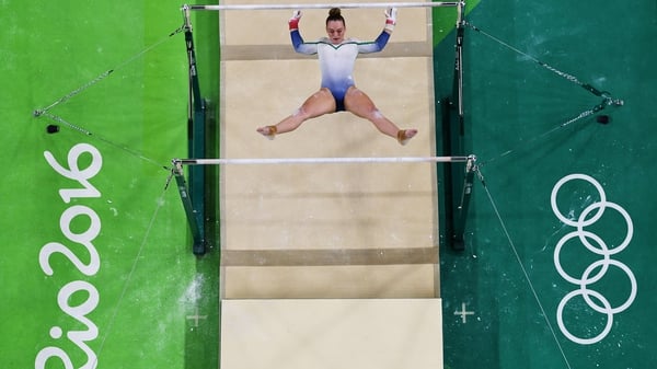 Ireland's Ellis O'Reilly hangs between the the uneven bars. She recorded a final score of 47.932 in all-round qualifying