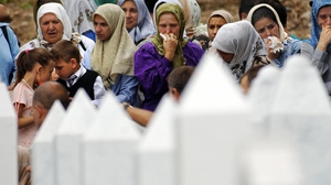 Relatives of victims of the Srebrenica massacre mourn for their loved ones