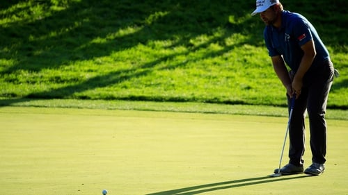 Ryan Moore plays a shot on the tenth hole during the third round of the John Deere Classic
