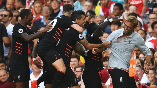 Liverpool players mob Jurgen Klopp following Sadio Mane's debut goal