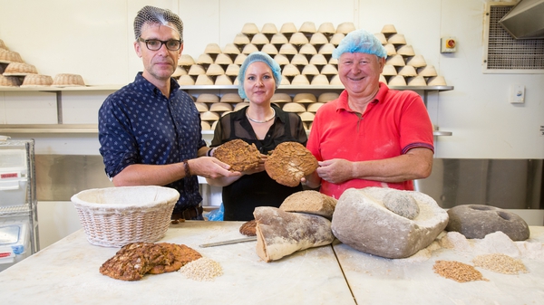Dr Ben Gearey (L), Dr Katharina Becker and Declan Ryan of Arbutus Bread recreate Iron Age bread-making (Pic: UCC)