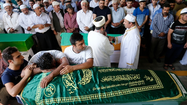 Relatives attend the funerals of some of the victims who were killed in the bomb attack in Gaziantep