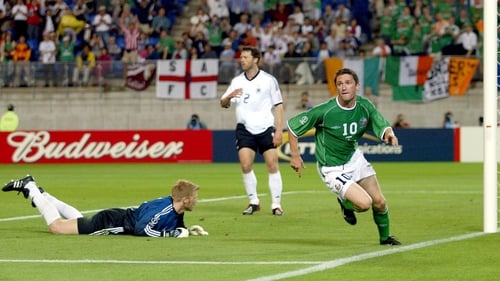 Robbie Keane wheels away in celebration after scoring late on against Germany at the 2002 World Cup