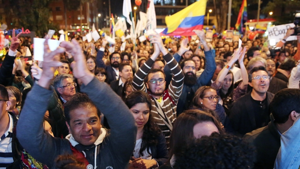 People celebrate the announcement in Bogota