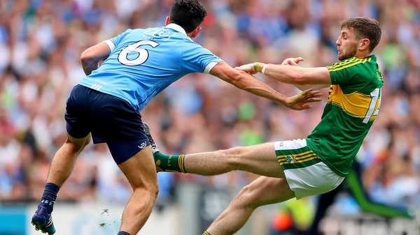 Cian O'Sullivan fends off the challenge of Kerry's Paul Geaney