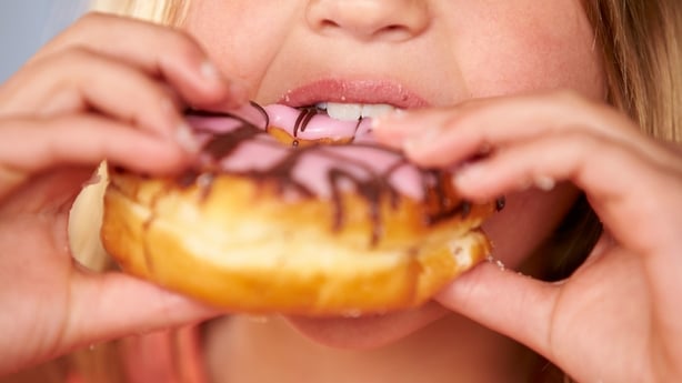 girl eating unhealthy snack