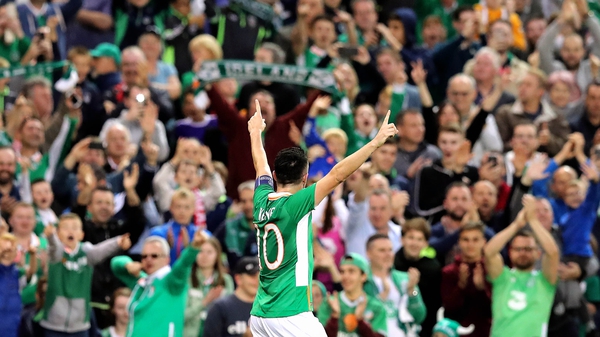 Robbie Keane salutes the crowd after his goal
