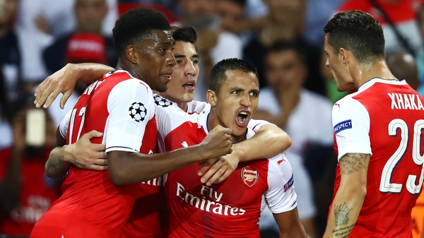 Alexis Sanchez is congratulated after his late leveller
