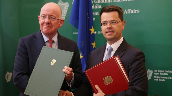 Charlie Flanagan (l) James Brokenshire signed the agreement this afternoon