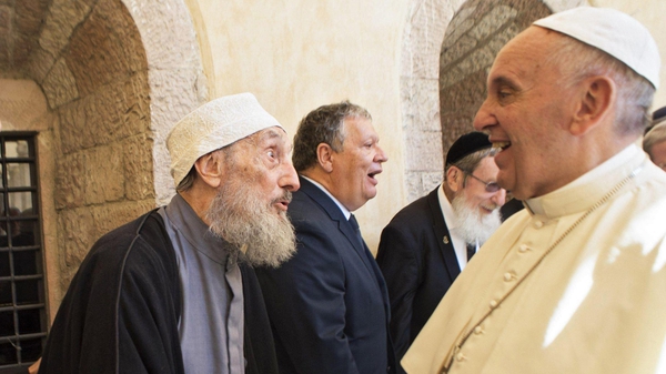 Pope Francis (R) greets participants in a day of prayer for peace in Assisi, Italy