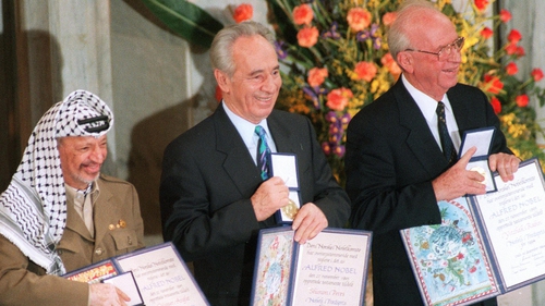 Yasser Arafat (l), Shimon Peres (m) and Israeli Premier Yitzhak Rabin win the 1994 Nobel Peace Prize