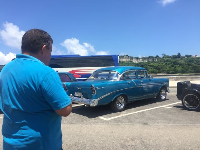 Taxi driver colour coordinating with his car