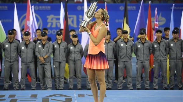 Petra Kvitova poses with the trophy at Optics Valley International Tennis Center