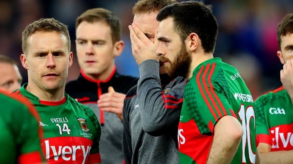 Mayo's goalkeeper Robert Hennelly consoled by Andy Moran and Kevin McLoughlin after the game