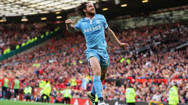Joe Allen leaps into the air in delight after his equaliser
