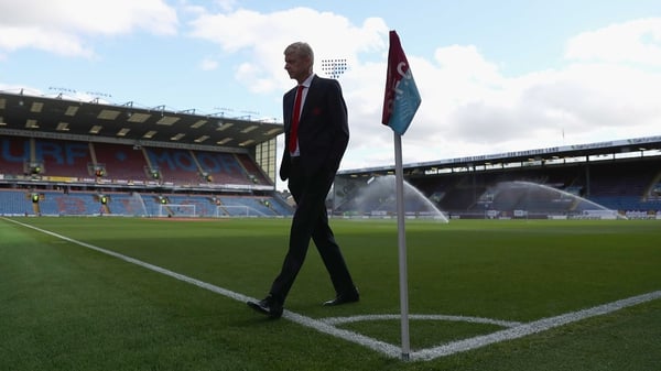 Arsene Wenger inspects the Turf Moor pitch prior to kick-off