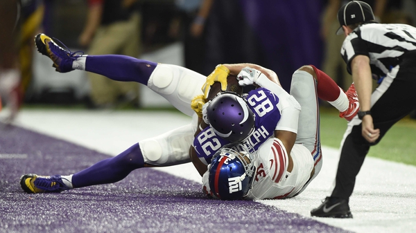 Kyle Rudolph (82) touches down for the Vikings