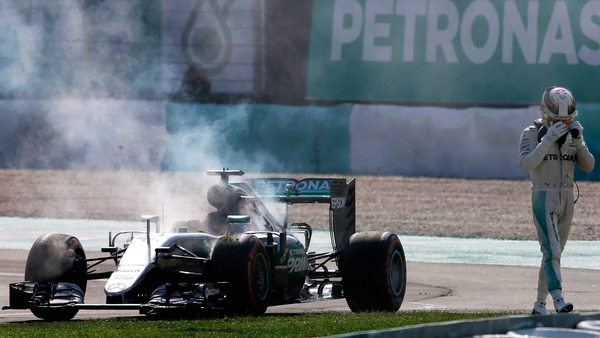 Lewis Hamilton walks away from his car during the Malaysian Grand Prix