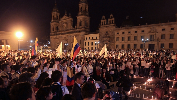 Colombians take part in a 'March for Peace' in Bogota yesterday
