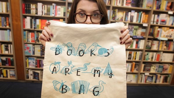 Illustrator Kathi 'Fatti' Burke with her tote bag celebrating Irish books and bookshops.