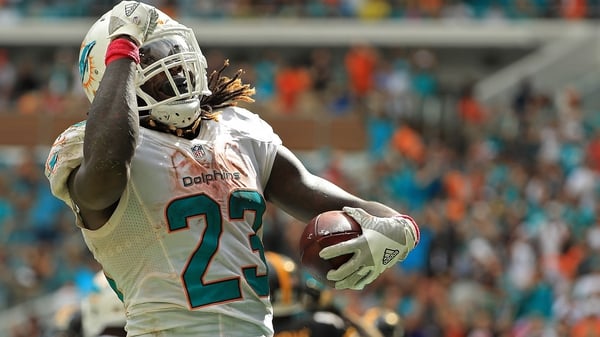 Jay Ajayi of the Miami Dolphins celebrates a touchdown against the Pittsburgh Steelers