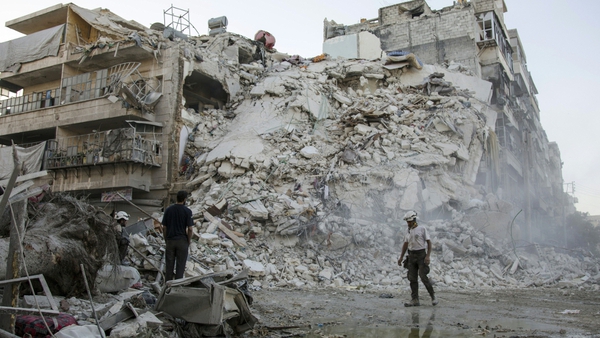 Members of the Syrian Civil Defence, known as the White Helmets, search for victims of a bomb attack in Aleppo earlier this week