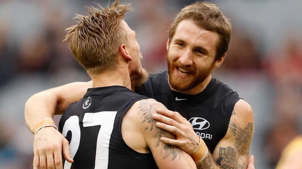Zach Tuohy (R) has penned a four-year deal with Geelong